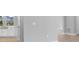 Open concept showing transition to the kitchen and its white cabinetry at 2982 Arranmore Dr, Ormond Beach, FL 32174