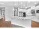 Bright, open kitchen featuring an island with a white countertop and stainless steel appliances at 2982 Arranmore Dr, Ormond Beach, FL 32174