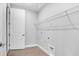 Bright laundry room featuring tile floors, door, and shelving, ideal for organization at 2982 Arranmore Dr, Ormond Beach, FL 32174