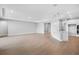 Spacious living room with recessed lighting, wood-look floors, and view into the kitchen at 2982 Arranmore Dr, Ormond Beach, FL 32174