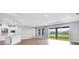 Open living area with sliding glass doors and seamless access to outdoor views at 2982 Arranmore Dr, Ormond Beach, FL 32174
