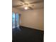 Bedroom with carpet and sliding glass doors to patio at 622 Riverview Ave, Altamonte Springs, FL 32714