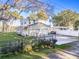 Beautiful home with a two-car garage, manicured lawn, and fenced yard, offering both charm and privacy at 1043 Lemon Bluff Rd, Osteen, FL 32764