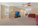 Spacious living room with modern ceiling fan and stairs leading to the second floor at 1054 Waterside Dr, Celebration, FL 34747