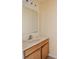 Bathroom features a vanity with white countertop and wood cabinets at 2824 Corrigan Dr, Deltona, FL 32738