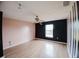Bedroom with pink and black accent walls and ceiling fan at 2824 Corrigan Dr, Deltona, FL 32738