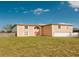 Inviting two-story home featuring a large front yard and an attached two car garage at 2824 Corrigan Dr, Deltona, FL 32738