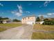 Inviting two-story home featuring a large front yard and an attached two car garage at 2824 Corrigan Dr, Deltona, FL 32738