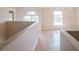 Upstairs hallway with railing overlooking the lower level at 2824 Corrigan Dr, Deltona, FL 32738