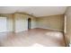 Large living room with wood floors and view of arched doorway at 2824 Corrigan Dr, Deltona, FL 32738