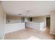 Bright living room with laminate wood flooring, neutral walls, and natural light at 2824 Corrigan Dr, Deltona, FL 32738