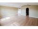 Open-plan living room featuring wood floors and access to other rooms at 2824 Corrigan Dr, Deltona, FL 32738