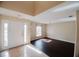 Inviting foyer and living room area featuring dark floors and ample natural light at 2824 Corrigan Dr, Deltona, FL 32738