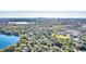 Breathtaking aerial view showcasing the neighborhood, lake, and city skyline in the distance at 786 Antonette Ave, Winter Park, FL 32789