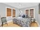Cozy bedroom featuring warm natural light from dual windows and hardwood flooring at 786 Antonette Ave, Winter Park, FL 32789