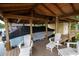 Covered boat dock with boat, storage shed, and lounge chairs offer waterfront relaxation and convenient boat storage at 786 Antonette Ave, Winter Park, FL 32789