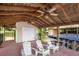 Covered boat dock with ceiling fans, Adirondack chairs, and boat lift ready for lake adventures at 786 Antonette Ave, Winter Park, FL 32789