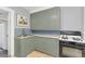 Charming kitchen with shaker cabinets and a stainless steel sink at 786 Antonette Ave, Winter Park, FL 32789