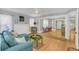 Spacious living room open to the dining area, featuring hardwood floors and lots of natural light at 786 Antonette Ave, Winter Park, FL 32789