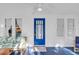 Bright sunroom with white walls, a blue floor, and a comfortable seating area by large windows at 786 Antonette Ave, Winter Park, FL 32789