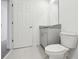 Small bathroom with granite countertop and toilet at 16332 Happy Eagle Dr, Clermont, FL 34714