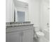 Bathroom featuring modern vanity and tub, blending style with functionality for a serene experience at 16332 Happy Eagle Dr, Clermont, FL 34714