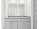 Bathroom featuring double sinks, a stylish and efficient design for modern living at 16332 Happy Eagle Dr, Clermont, FL 34714
