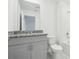 Bright bathroom showcasing granite counters, dual sinks, and glass enclosed shower at 16332 Happy Eagle Dr, Clermont, FL 34714