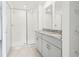 Bathroom featuring dual vanity sinks, offering convenience and style for your daily routine at 16332 Happy Eagle Dr, Clermont, FL 34714