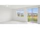 Bright bedroom with a window, sliding glass doors, offering community views and natural light at 16332 Happy Eagle Dr, Clermont, FL 34714