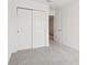Clean bedroom featuring plush carpeting and closet with sliding doors at 16332 Happy Eagle Dr, Clermont, FL 34714