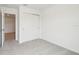 Bright bedroom featuring plush carpeting and closet with sliding doors at 16332 Happy Eagle Dr, Clermont, FL 34714