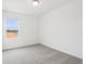 Well-lit bedroom with a large window, neutral paint, and plush carpeting at 16332 Happy Eagle Dr, Clermont, FL 34714