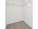 Walk-in closet with wire shelving, designed for optimal organization and storage solutions at 16332 Happy Eagle Dr, Clermont, FL 34714