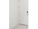 Elegant white front door with a modern lock system for enhanced security and curb appeal at 16332 Happy Eagle Dr, Clermont, FL 34714