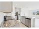 Beautiful kitchen features granite countertops, stainless steel appliances, and ample cabinet space at 16332 Happy Eagle Dr, Clermont, FL 34714