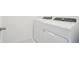Laundry room equipped with modern white washer and dryer appliances at 16332 Happy Eagle Dr, Clermont, FL 34714