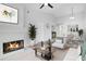Cozy living room with fireplace and adjacent dining area at 2223 Stonington Ave # 2223, Orlando, FL 32817