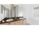 Double vanity bathroom with granite countertops and a bathtub at 230 Bay Meadow Dr, Kissimmee, FL 34746