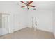 Spacious bedroom with tile floors and double door closet at 230 Bay Meadow Dr, Kissimmee, FL 34746