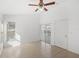 Bright bedroom with tile floors, ceiling fan and pool access at 230 Bay Meadow Dr, Kissimmee, FL 34746