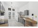 Modern kitchen with gray cabinets and stainless steel appliances at 230 Bay Meadow Dr, Kissimmee, FL 34746