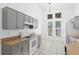 Gray cabinets and white appliances in kitchen at 230 Bay Meadow Dr, Kissimmee, FL 34746