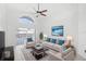 Beige couch, two armchairs, and ocean art on wall at 230 Bay Meadow Dr, Kissimmee, FL 34746