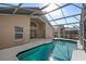 Screened-in pool area with a patio at 230 Bay Meadow Dr, Kissimmee, FL 34746