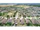 Scenic aerial view of a suburban neighborhood featuring green spaces, parks, and well-maintained residences at 236 Barrington Dr, Haines City, FL 33844