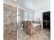 Bathroom featuring a glass shower, soaking tub, and access to the walk in closet at 236 Barrington Dr, Haines City, FL 33844