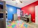 Colorful bedroom with bunk bed, desk and colorful ABC playmat at 236 Barrington Dr, Haines City, FL 33844