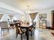 Dining room with table and seating for six, chandelier, and open concept to living room at 236 Barrington Dr, Haines City, FL 33844