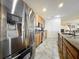 View of stainless steel refrigerator and appliances, countertop, and cabinets in this bright kitchen at 236 Barrington Dr, Haines City, FL 33844